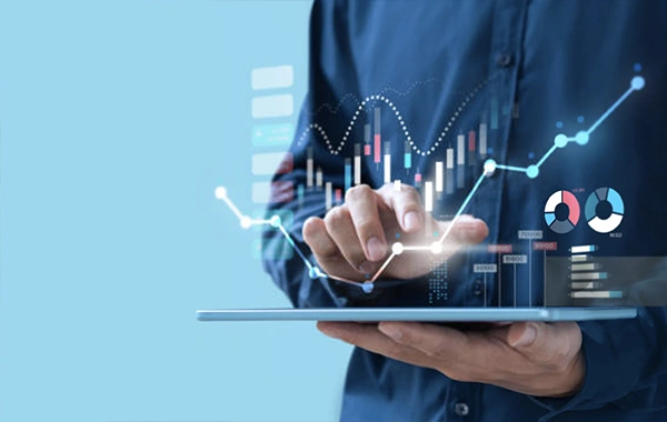 Business man holding tablet with graph of tax savings rising off screen